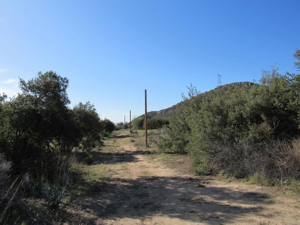 a view of a road with a building in the background
