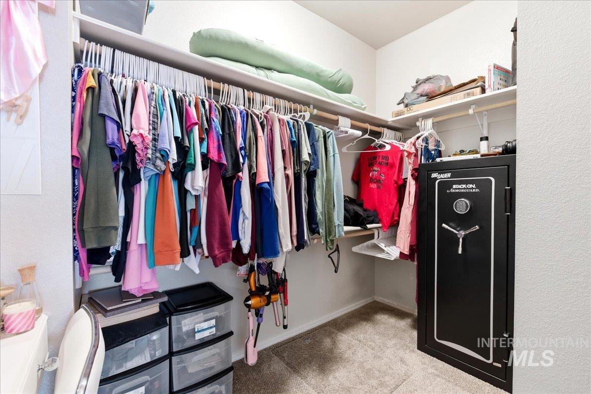 843 Southwest Levant Way Mountain Home, ID 83647 - Photo 16 of 45 Walk in closet featuring light carpet