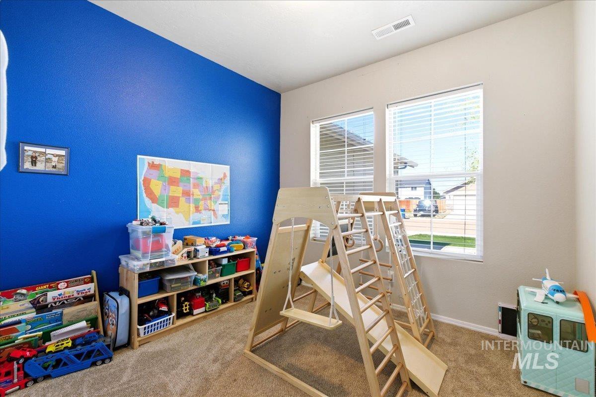 843 Southwest Levant Way Mountain Home, ID 83647 - Photo 19 of 45 Rec room featuring light carpet and baseboards