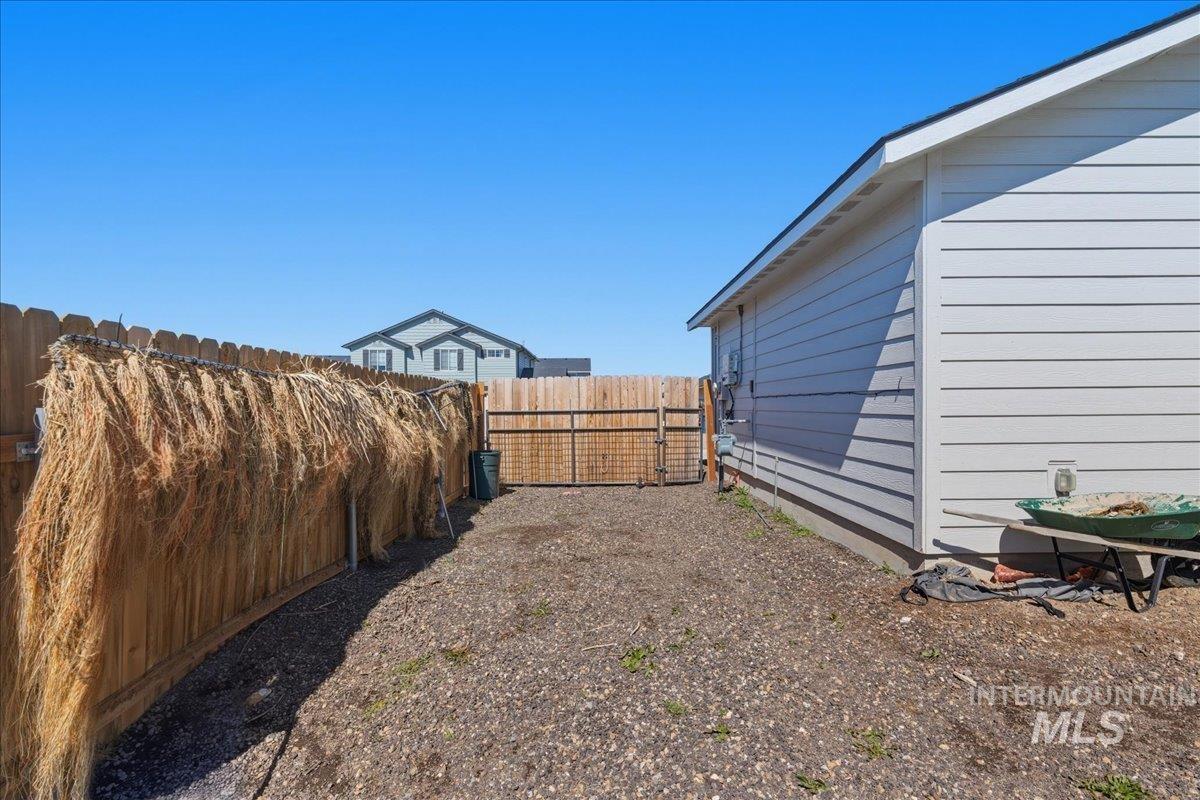 843 Southwest Levant Way Mountain Home, ID 83647 - Photo 26 of 45 Fenced backyard with a gate