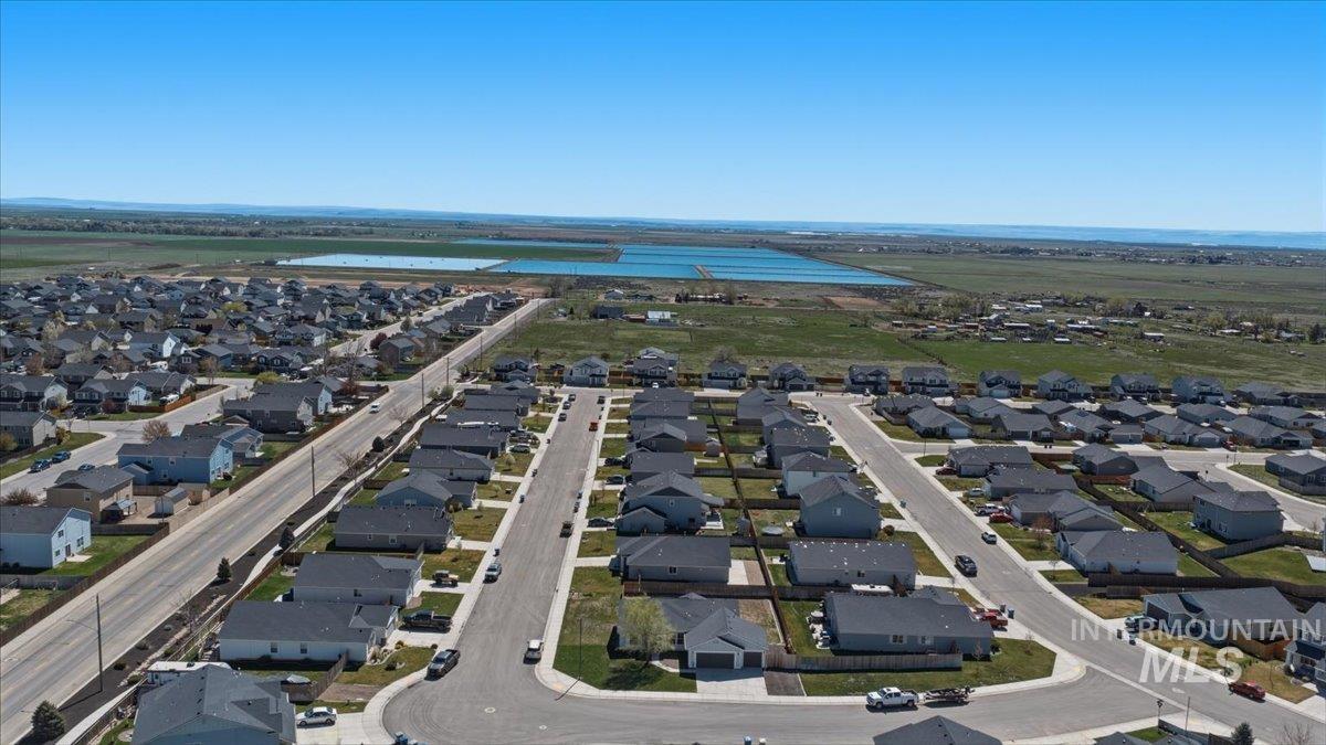 843 Southwest Levant Way Mountain Home, ID 83647 - Photo 31 of 45 Aerial perspective of suburban area featuring a nearby body of water