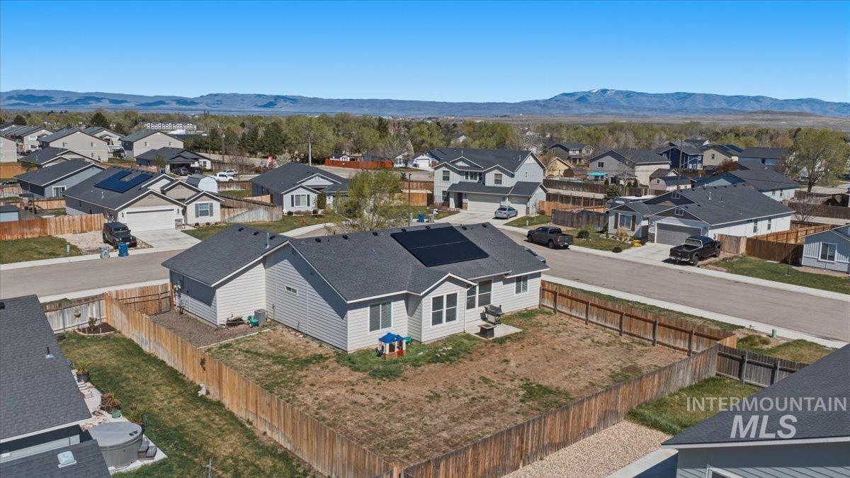 843 Southwest Levant Way Mountain Home, ID 83647 - Photo 38 of 45 Aerial perspective of suburban area with a mountain backdrop