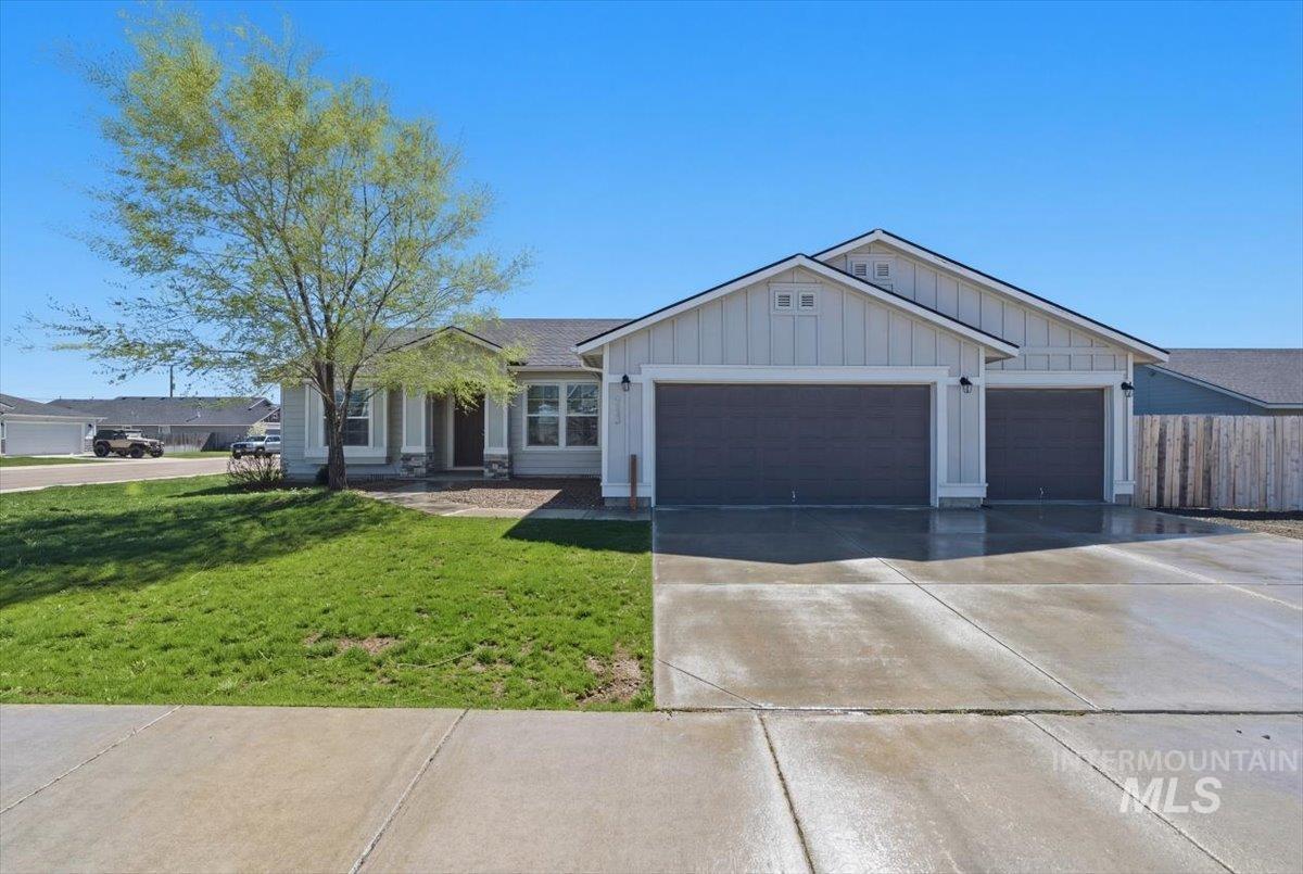 843 Southwest Levant Way Mountain Home, ID 83647 - Photo 40 of 45 View of front of property featuring board and batten siding, driveway, and a garage