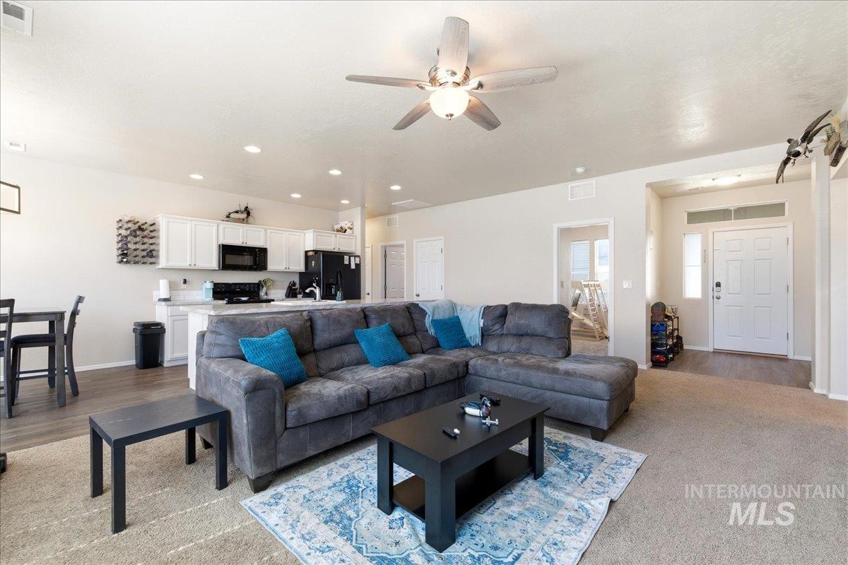 843 Southwest Levant Way Mountain Home, ID 83647 - Photo 7 of 45 Living room with baseboards and ceiling fan