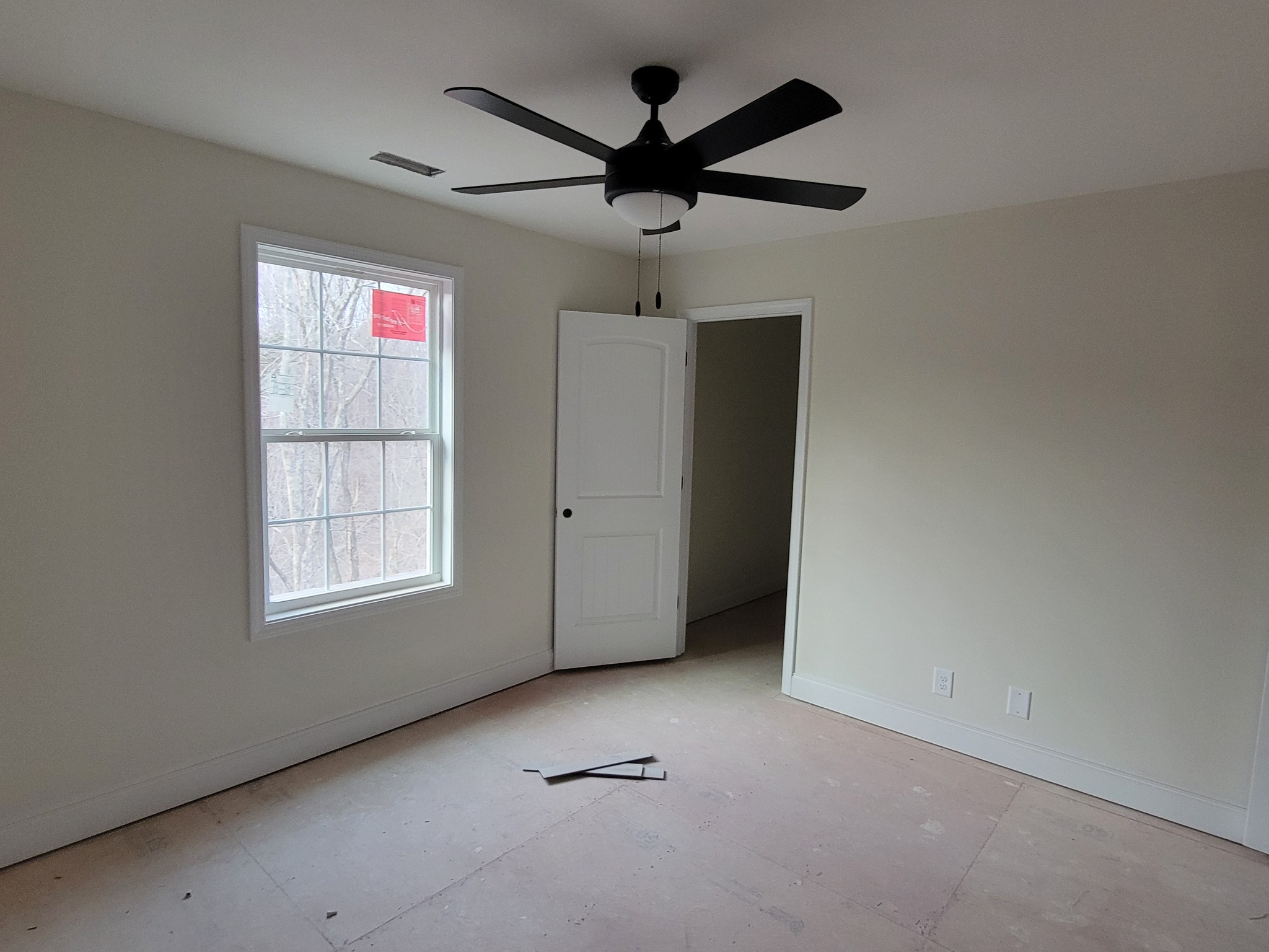 2285 Mockingbird Hill Road Palmyra, TN 37142 - Photo 12 of 19 an empty room with windows and ceiling fan