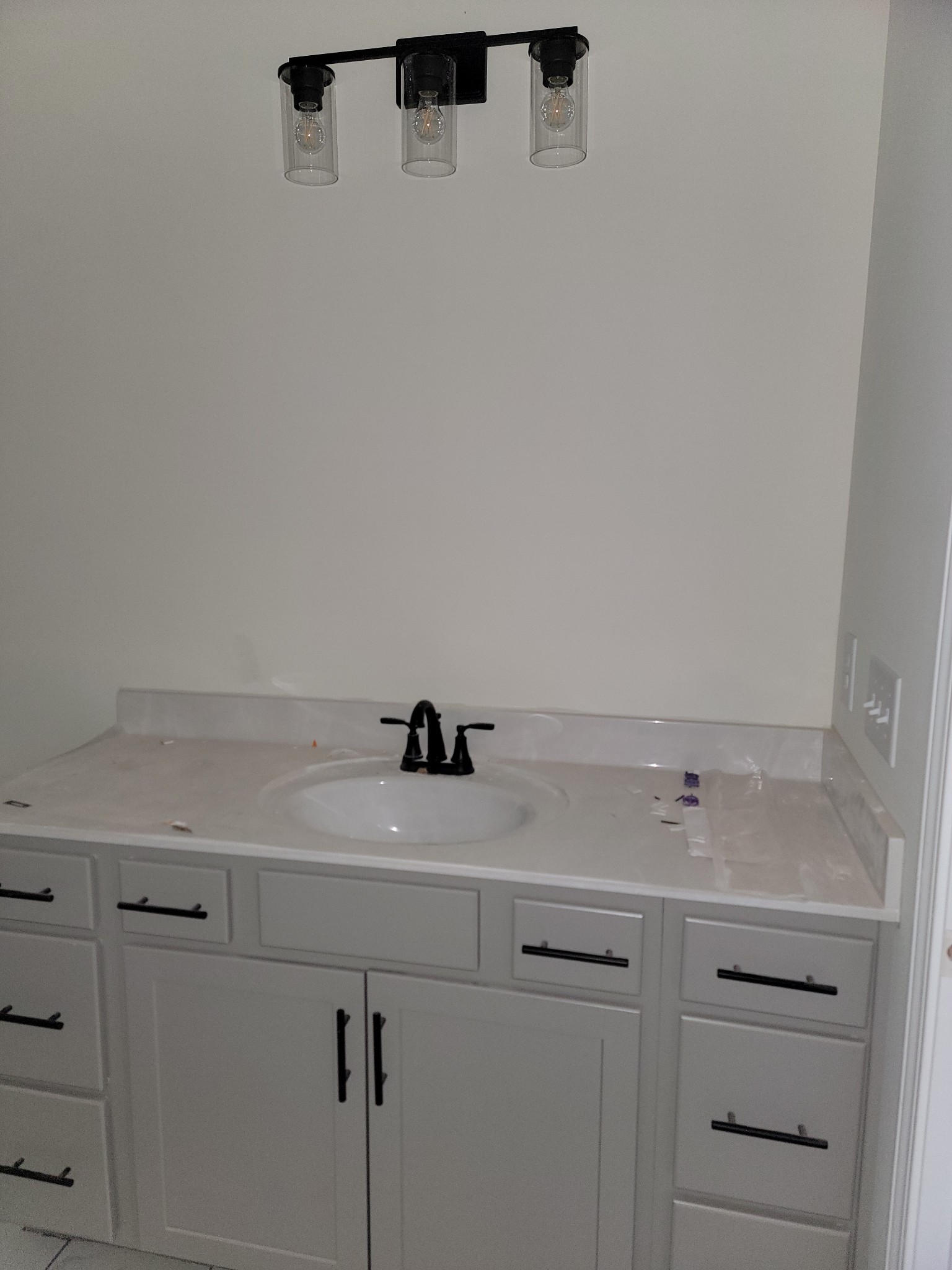 2285 Mockingbird Hill Road Palmyra, TN 37142 - Photo 13 of 19 a bathroom with a sink and cabinets