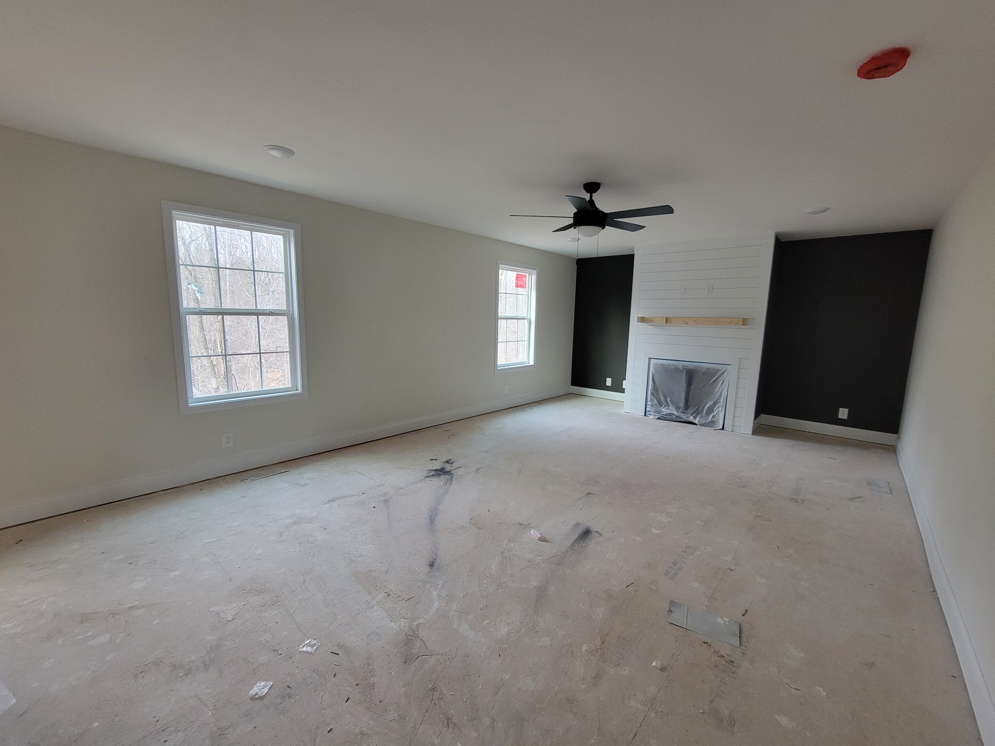 2285 Mockingbird Hill Road Palmyra, TN 37142 - Photo 2 of 19 a view of an empty room with a fireplace and a window