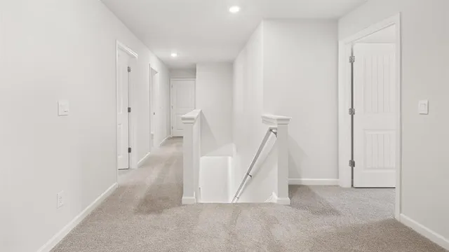 a view of a hallway with staircase