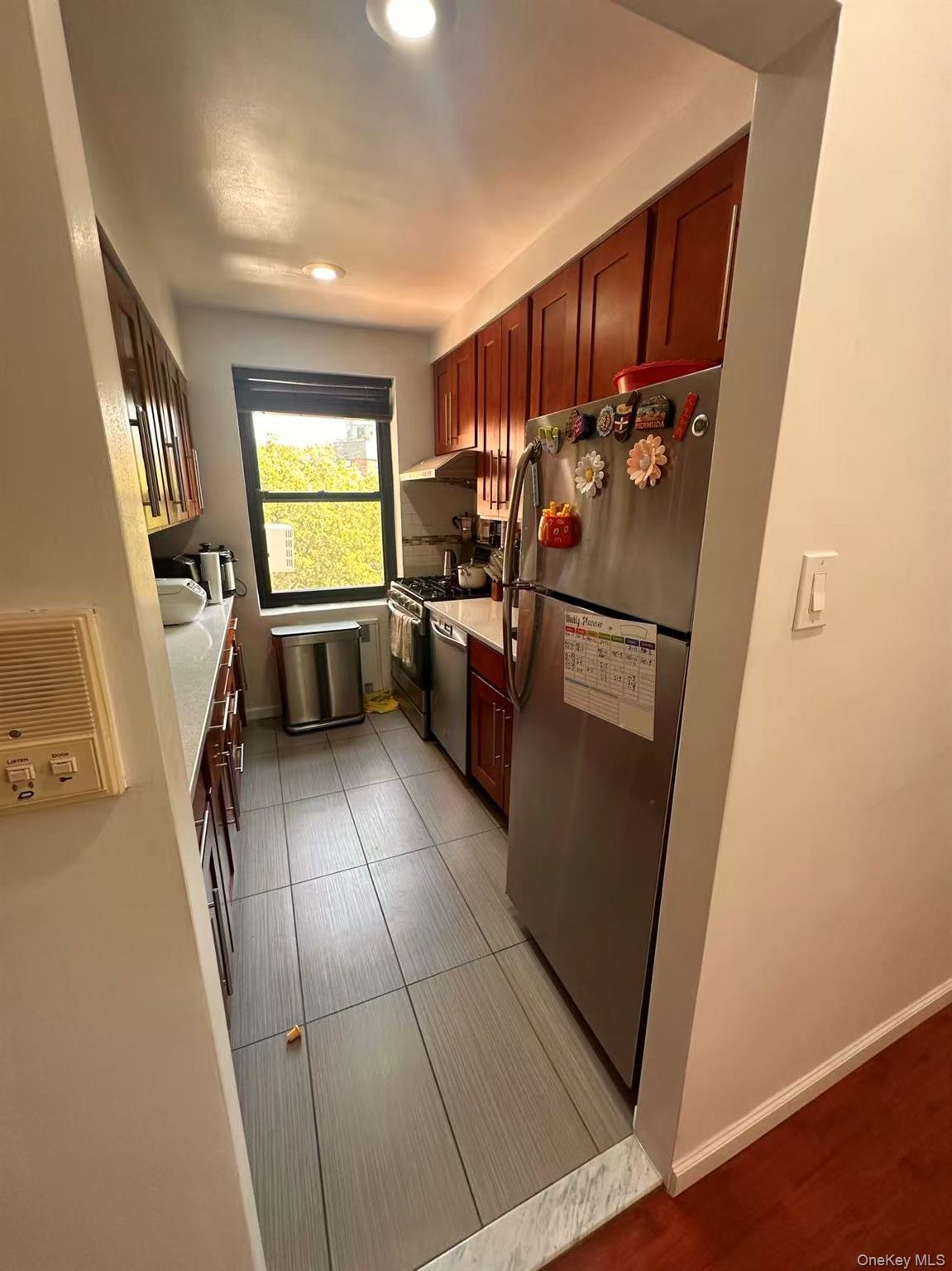 139-15 28th Road, Unit 6G Queens, NY 11354 - Photo 20 of 20 a kitchen with a refrigerator and a sink