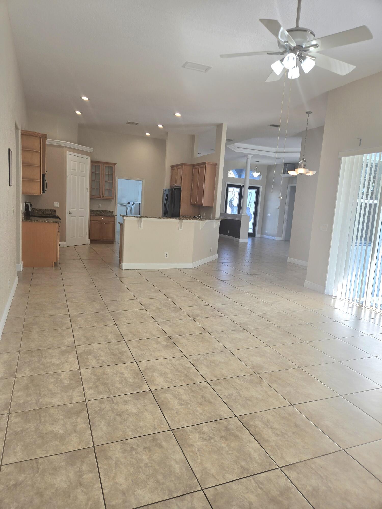2472 Southwest Valnera Street Port St. Lucie, FL 34953 - Photo 11 of 30 a view of a livingroom with kitchen and furniture