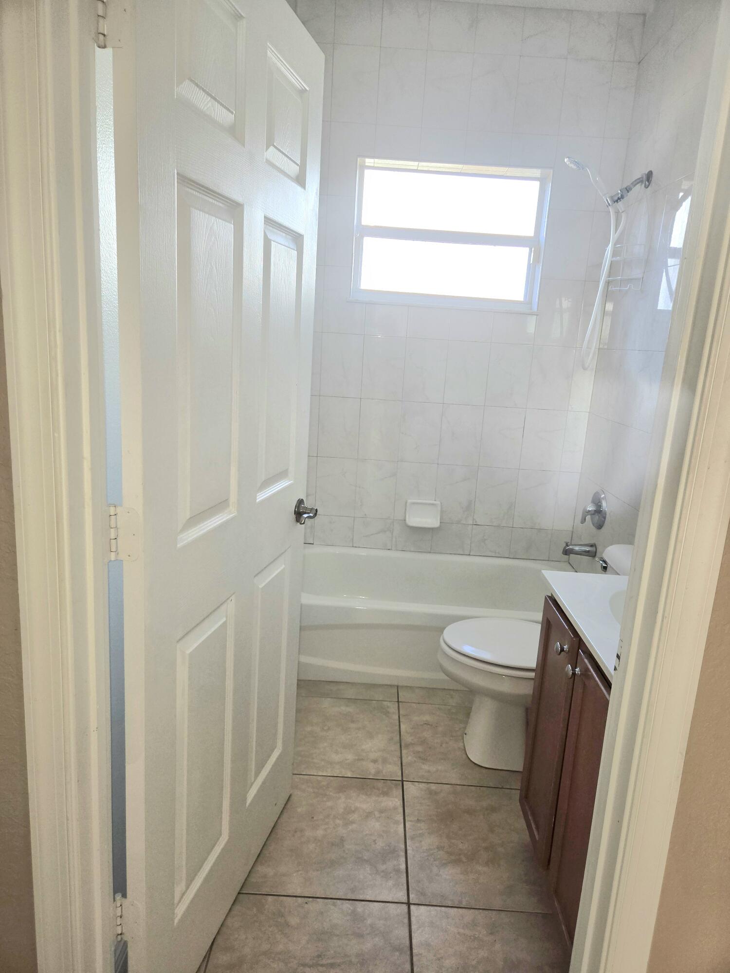 2472 Southwest Valnera Street Port St. Lucie, FL 34953 - Photo 25 of 30 a bathroom with a toilet and a shower