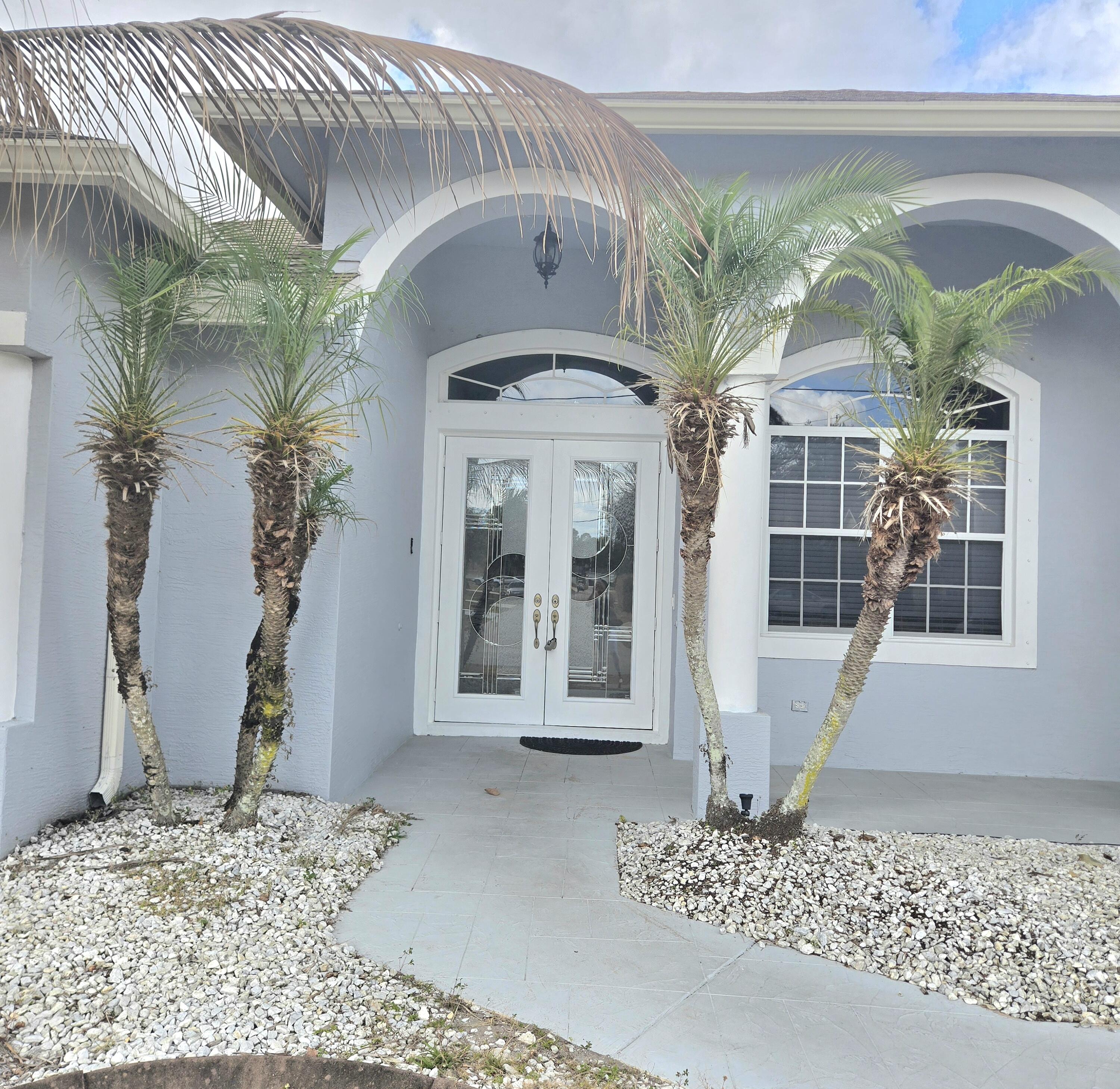 2472 Southwest Valnera Street Port St. Lucie, FL 34953 - Photo 3 of 30 a front view of a house