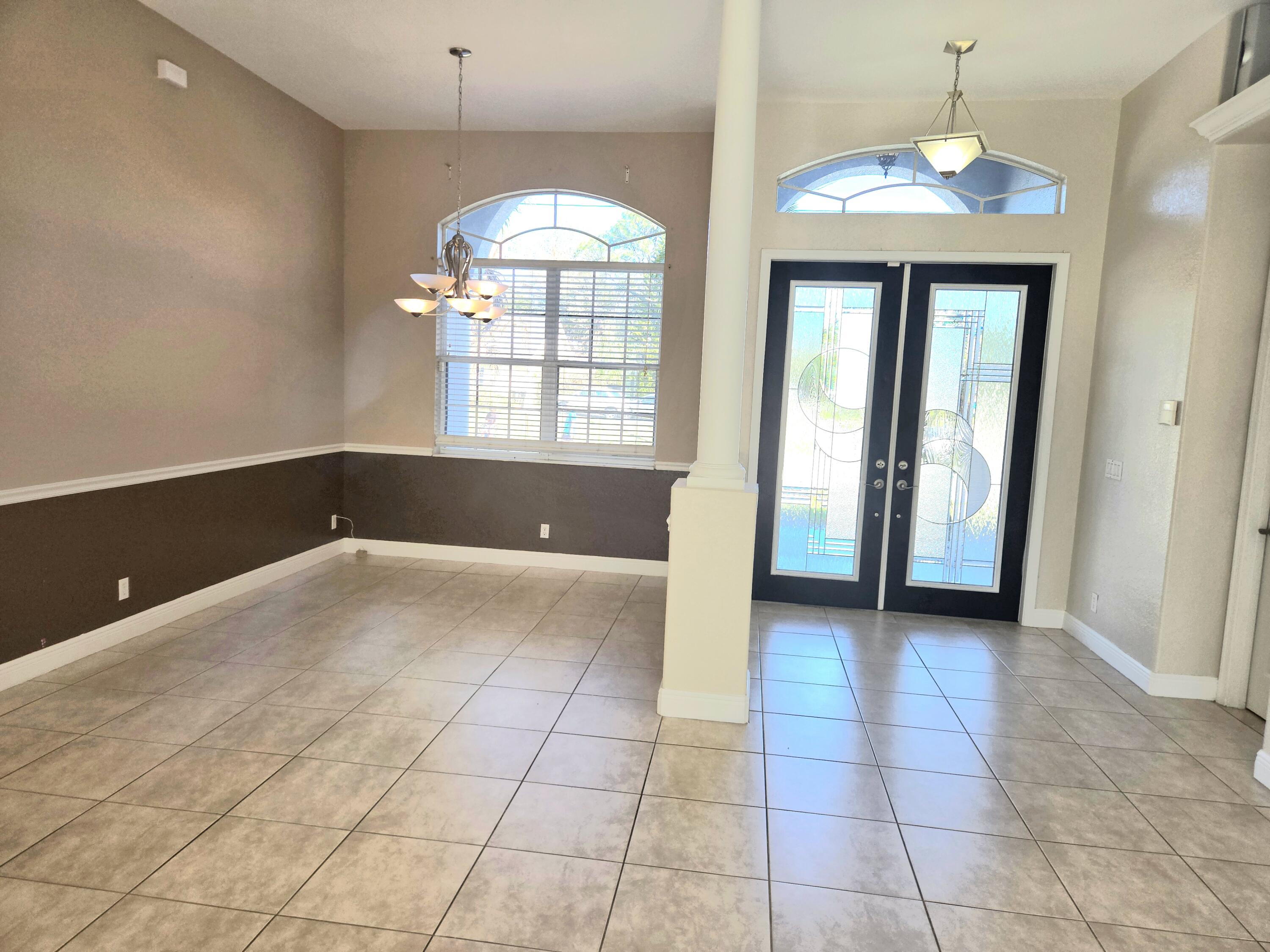 2472 Southwest Valnera Street Port St. Lucie, FL 34953 - Photo 7 of 30 a view of an empty room with a window