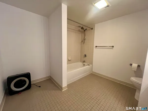 a bathroom with a sink a toilet and a bathtub