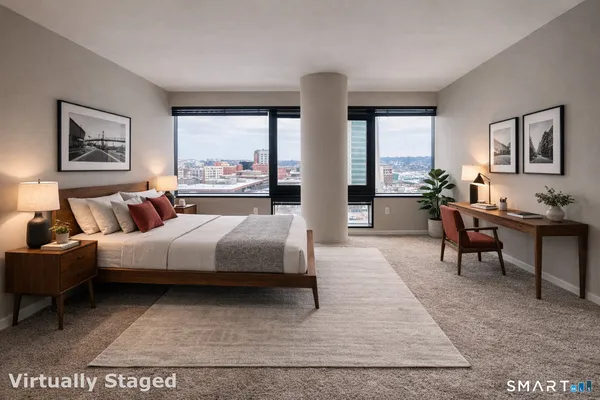a spacious bedroom with a large bed and a couch