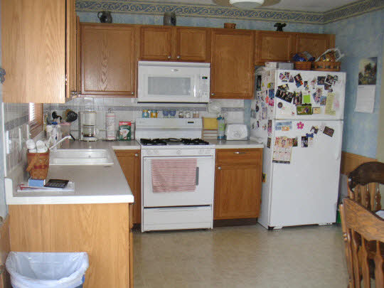 607 Bayfield Road Rockton, IL 61073 - Photo 5 of 6 a kitchen with stainless steel appliances a stove a sink and a refrigerator