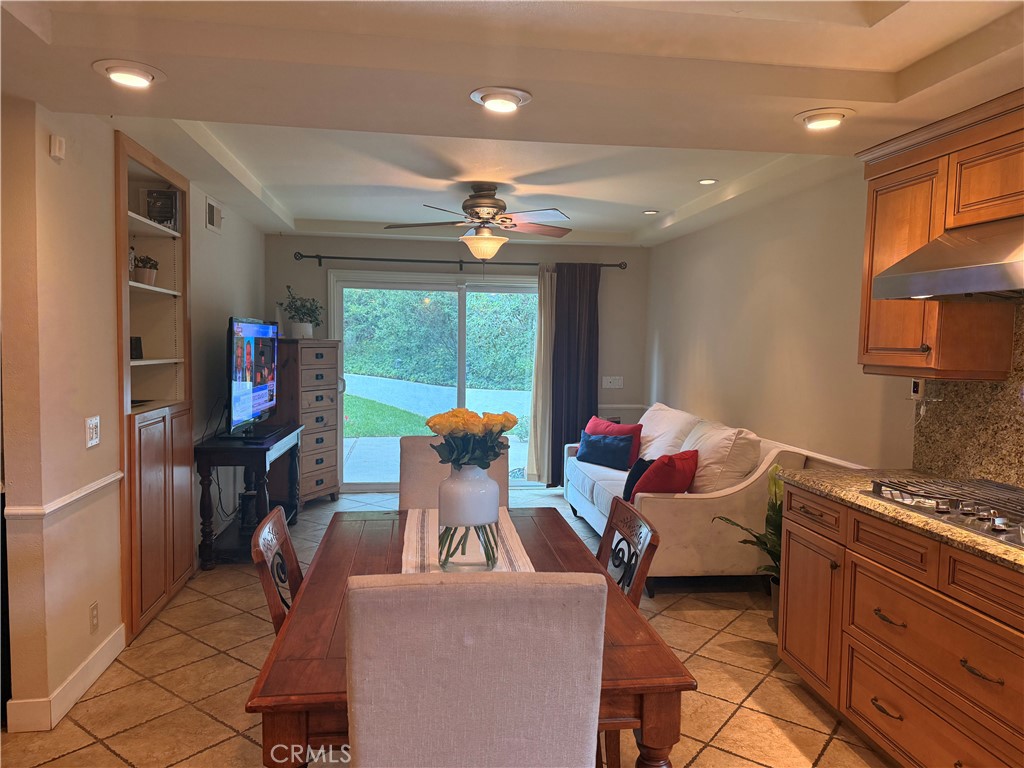 19238 Castlebay Lane Porter Ranch, CA 91326 - Photo 14 of 38 a living room with furniture a floor to ceiling window and a flat screen tv