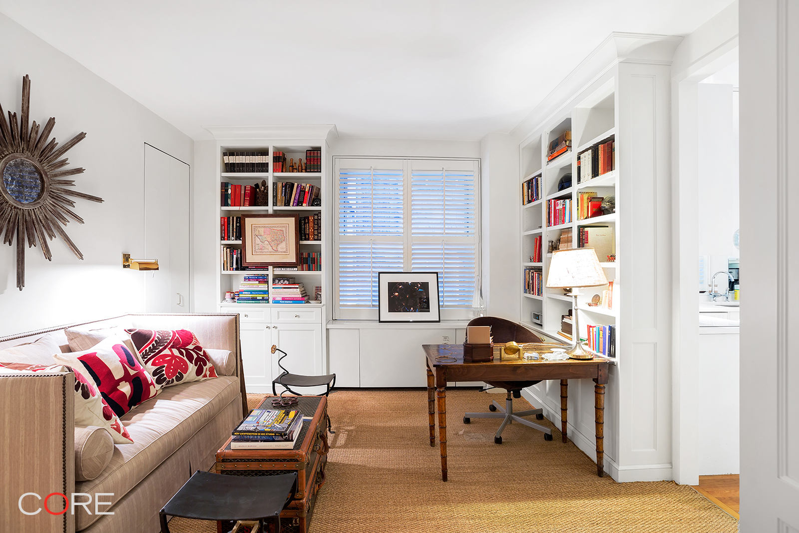 40 West 55th Street, Unit 5B Manhattan, NY 10019 - Photo 4 of 5 a living room with furniture and a workspace
