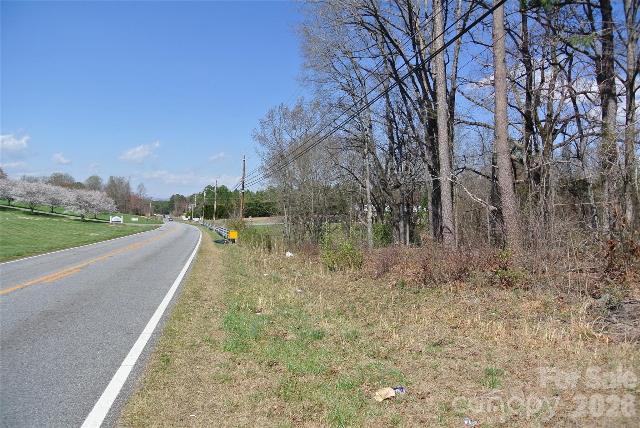 0 Hudlow Road Forest City, NC 28043 - Photo 3 of 13 a view of a street with a yard and large trees