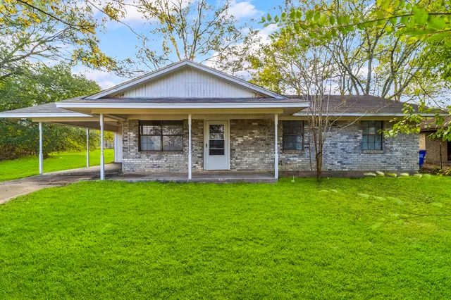 a front view of a house with yard