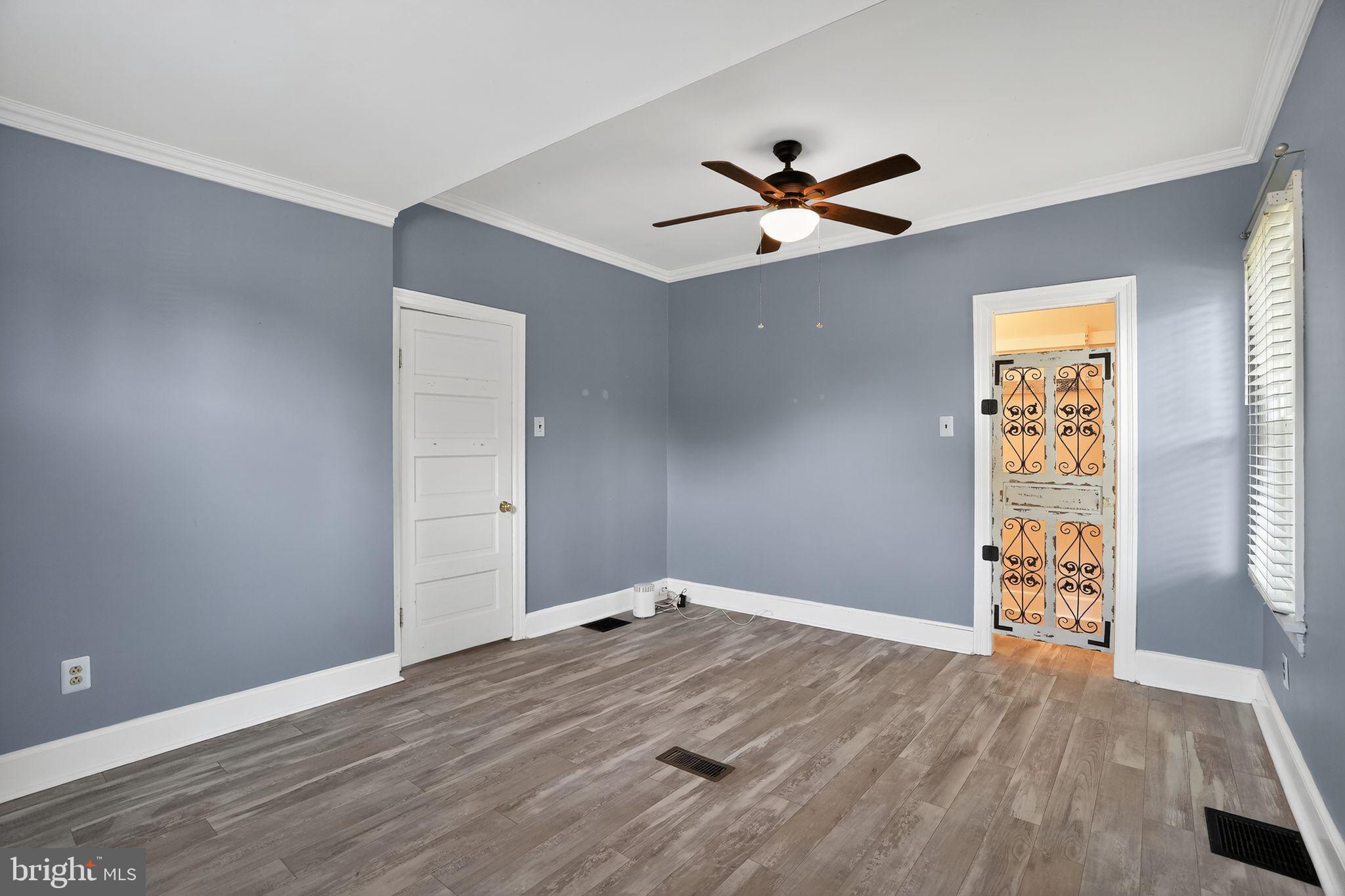 107 South Forklanding Road Maple Shade, NJ 08052 - Photo 12 of 36 a view of empty room with wooden floor and fan