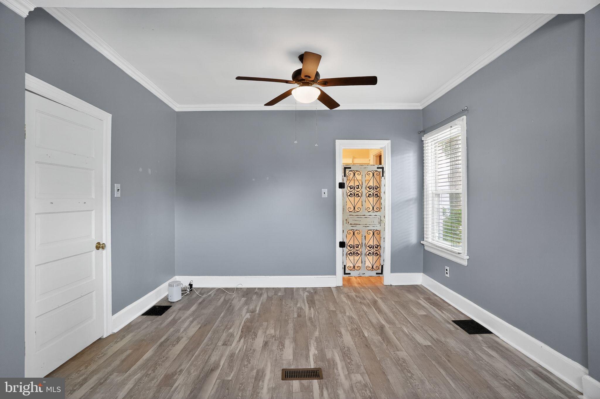 107 South Forklanding Road Maple Shade, NJ 08052 - Photo 14 of 36 a view of empty room with wooden floor and fan