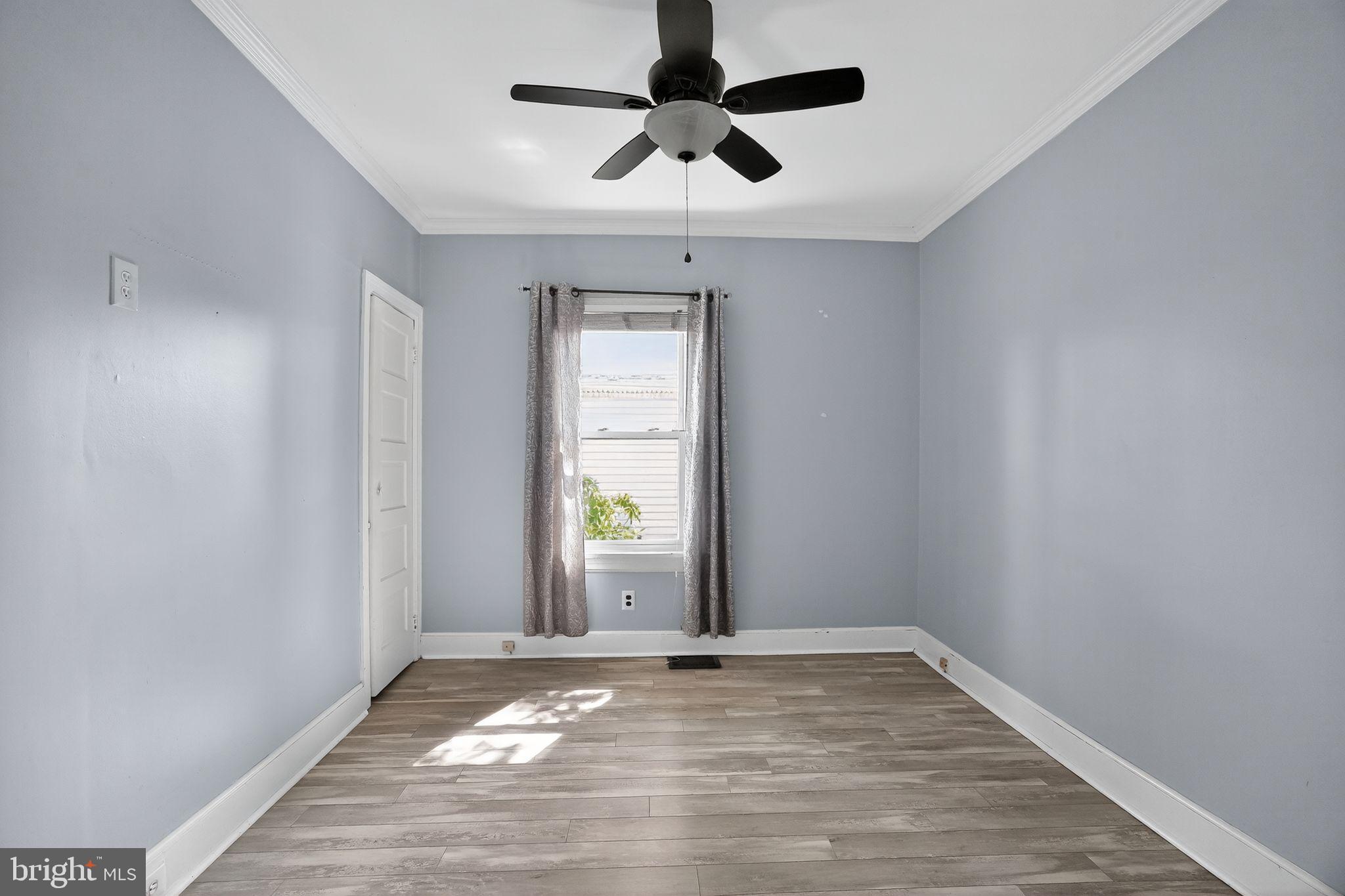 107 South Forklanding Road Maple Shade, NJ 08052 - Photo 15 of 36 wooden floor in an empty room with a window