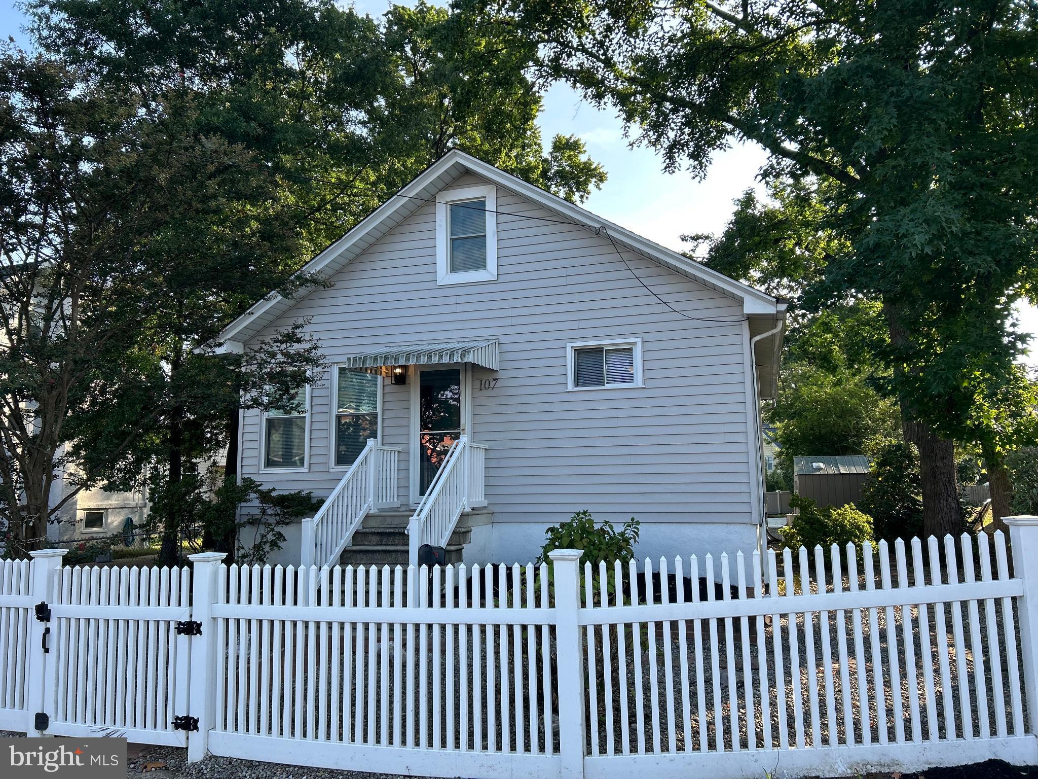 107 South Forklanding Road Maple Shade, NJ 08052 - Photo 2 of 36 a front view of a house with a garden