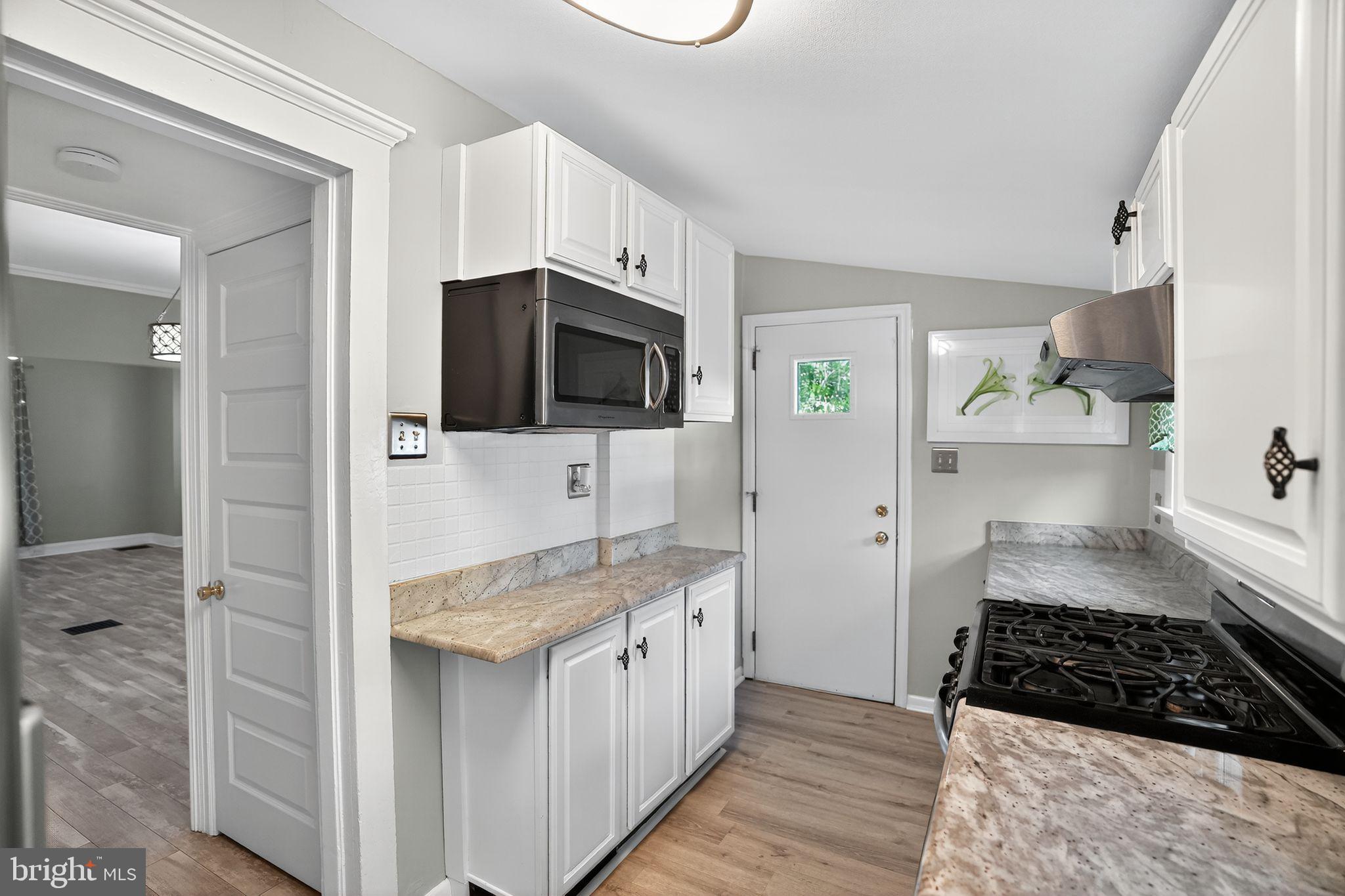 107 South Forklanding Road Maple Shade, NJ 08052 - Photo 21 of 36 a kitchen with a sink stove and refrigerator