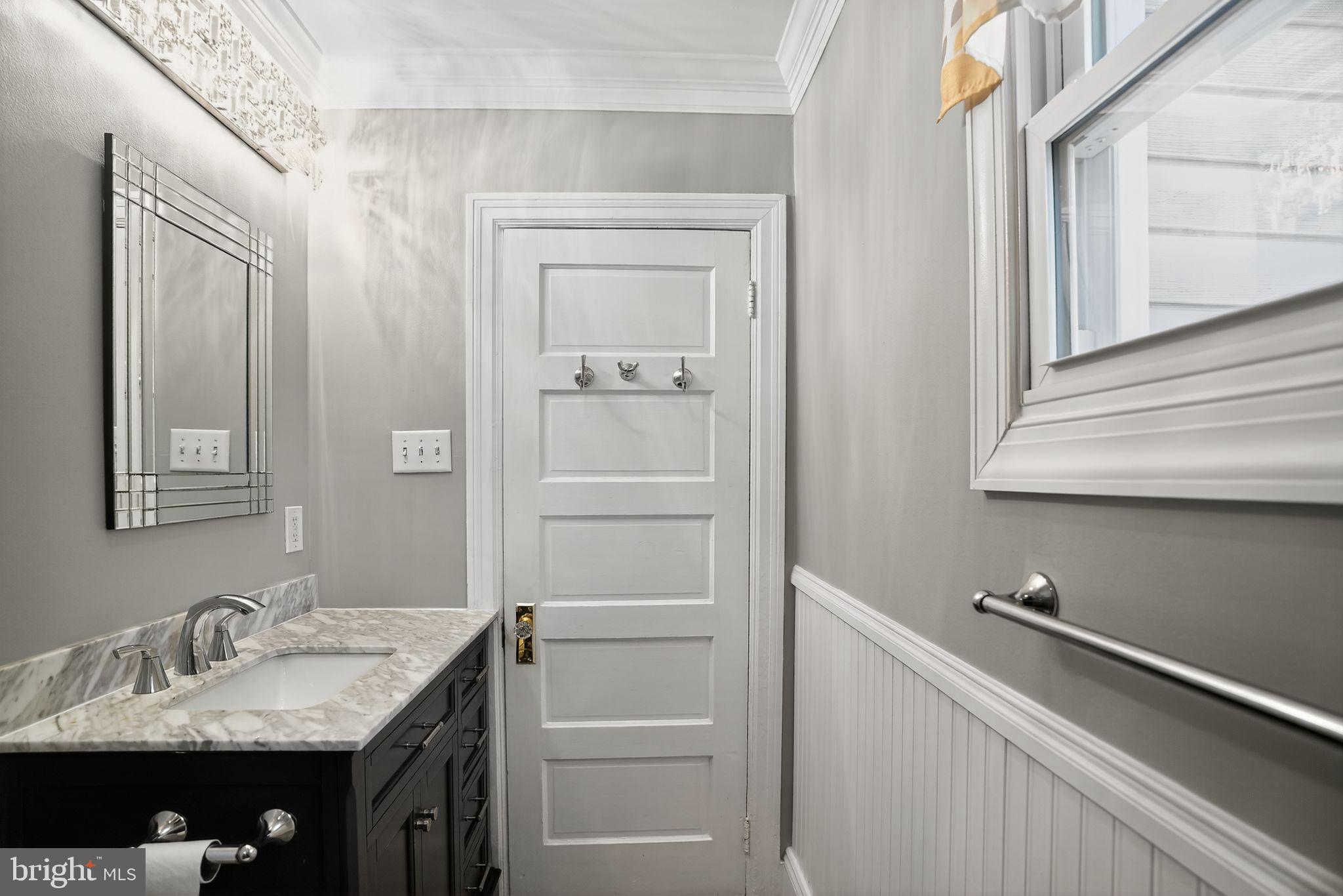 107 South Forklanding Road Maple Shade, NJ 08052 - Photo 30 of 36 a bathroom with a sink and a mirror