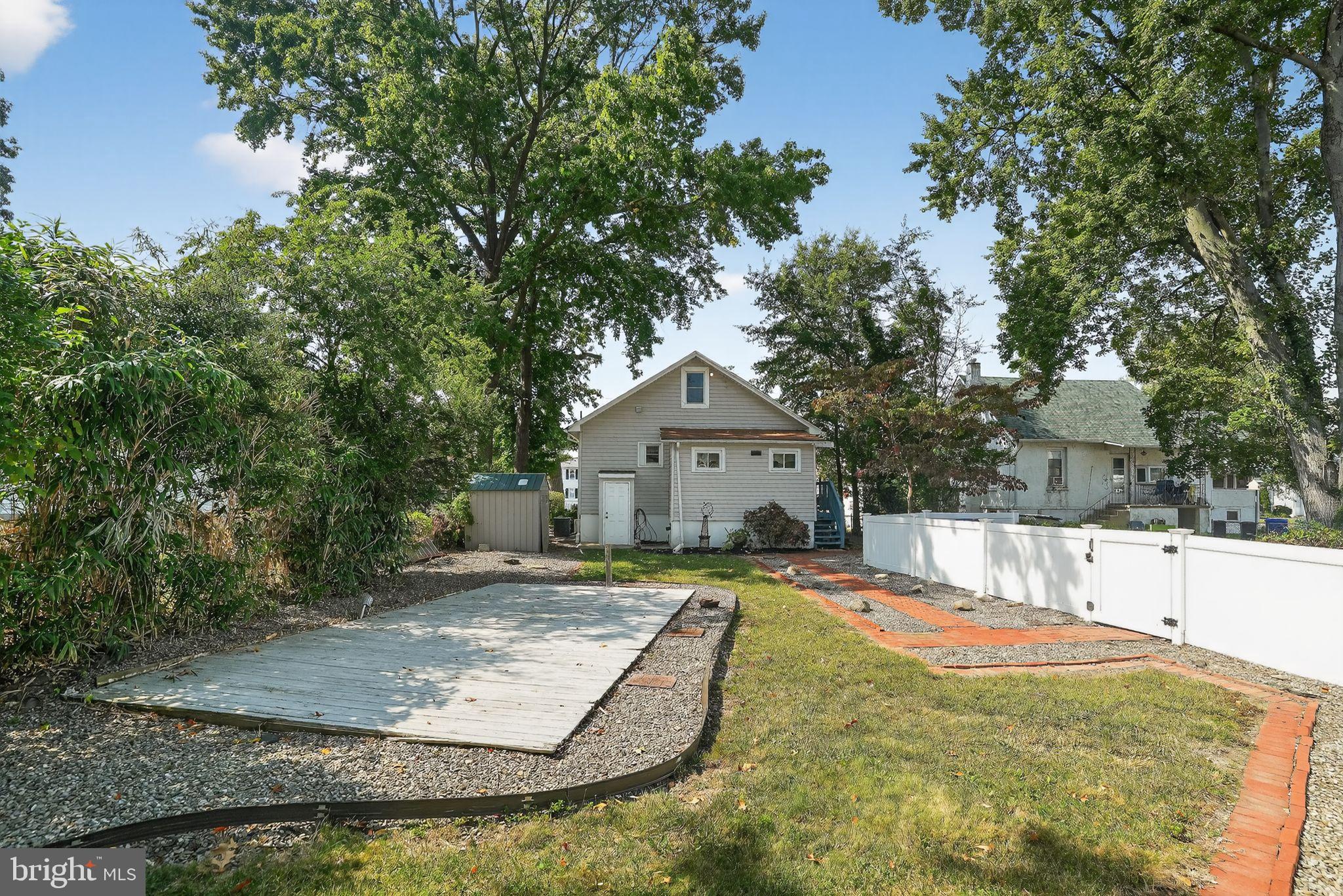 107 South Forklanding Road Maple Shade, NJ 08052 - Photo 4 of 36 a view of a house with yard and trees in the background