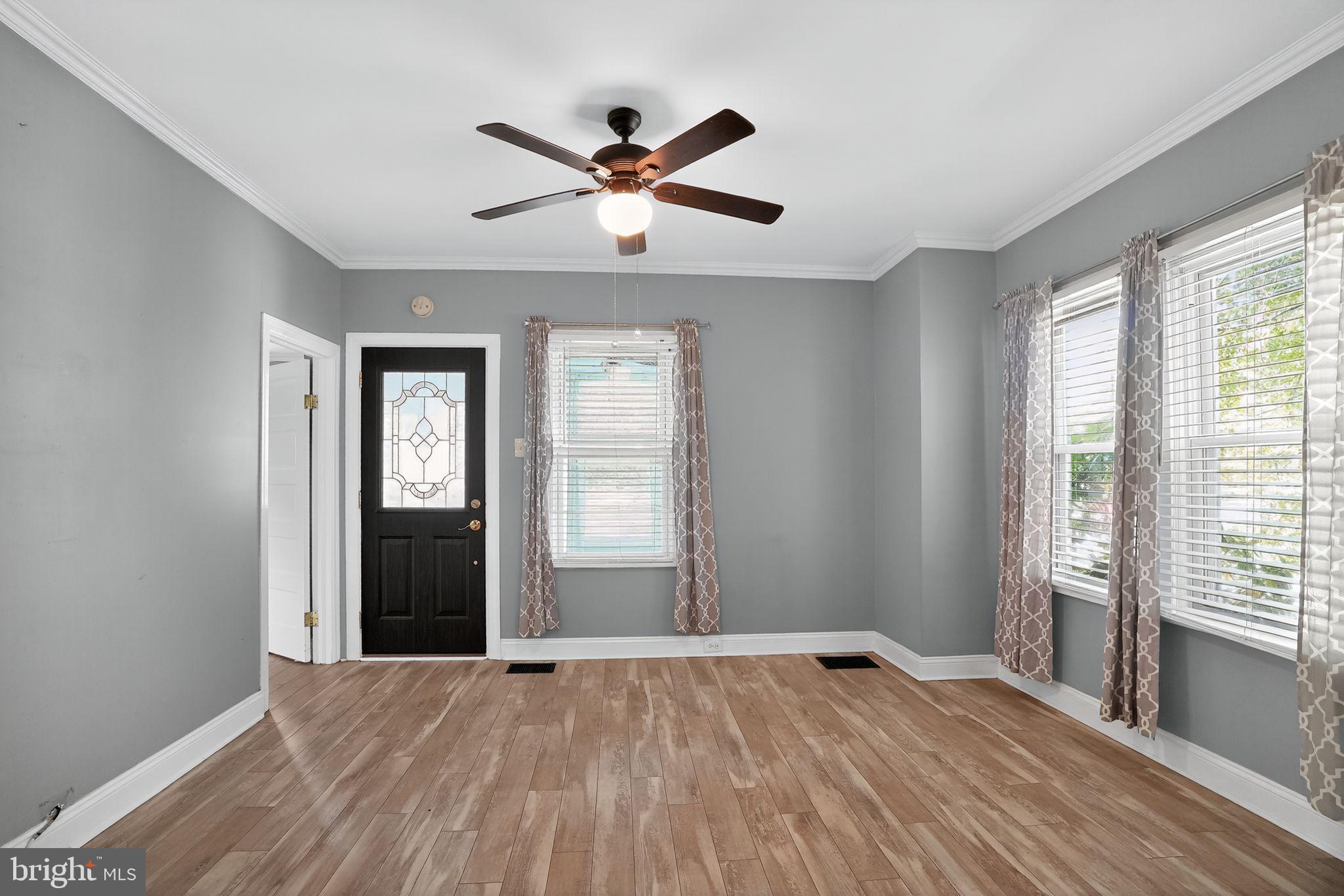 107 South Forklanding Road Maple Shade, NJ 08052 - Photo 6 of 36 a view of empty room with wooden floor and fan