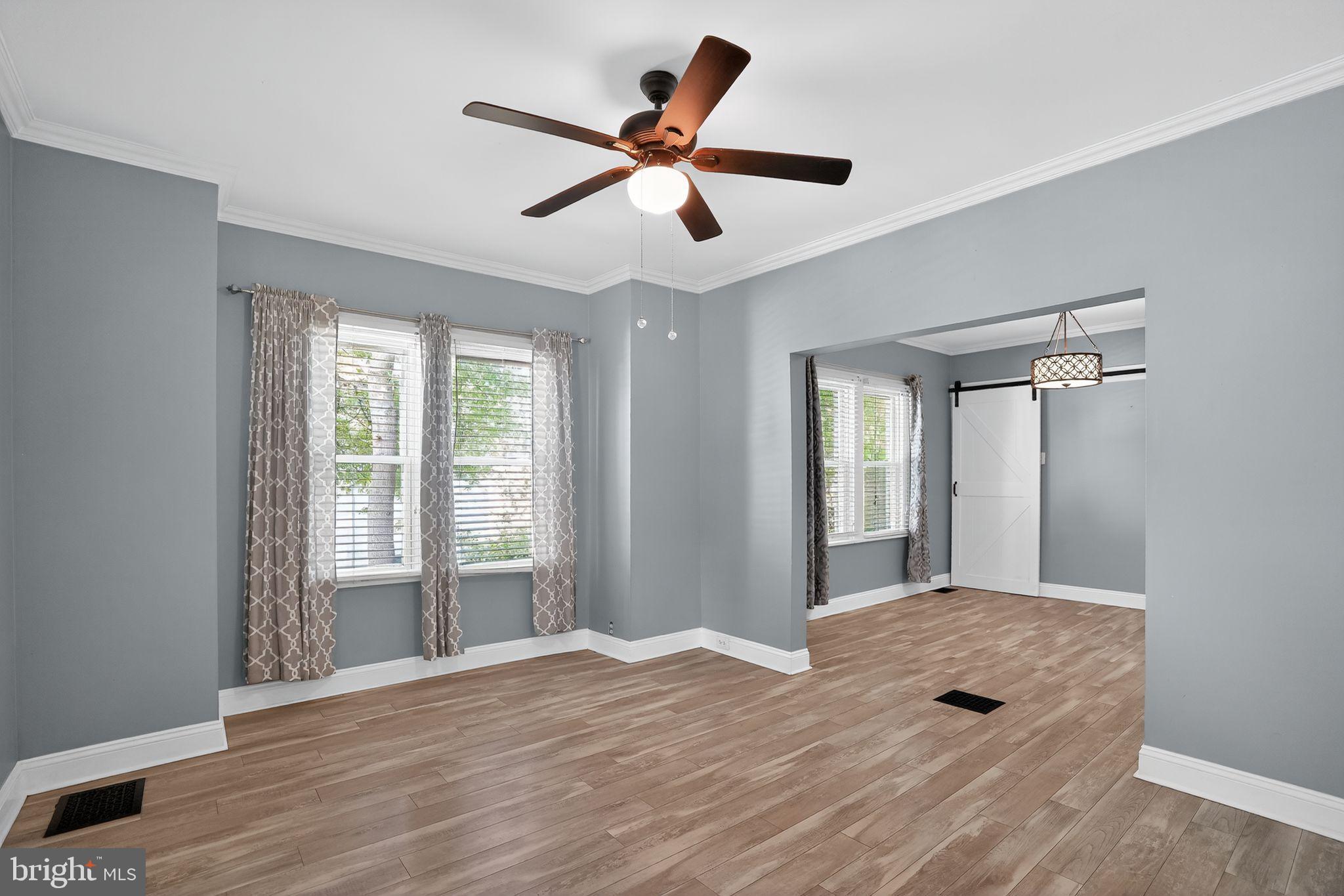 107 South Forklanding Road Maple Shade, NJ 08052 - Photo 8 of 36 a view of an empty room with wooden floor and a window