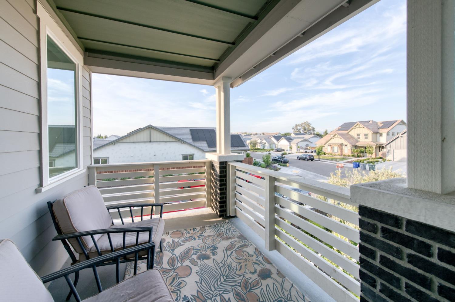 1736 North Renn Avenue Clovis, CA 93619 - Photo 24 of 66 a view of a city from a balcony with furniture