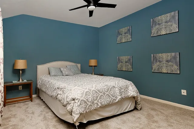 a bedroom with bed and window