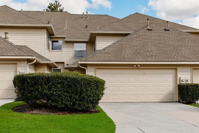front view of a house with a garden