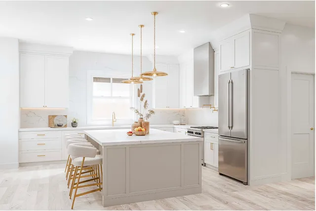 a kitchen with a sink appliances and cabinets