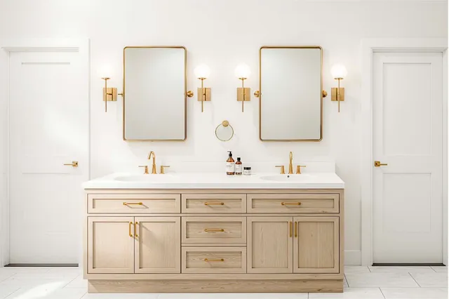 a bathroom with a sink vanity and mirror