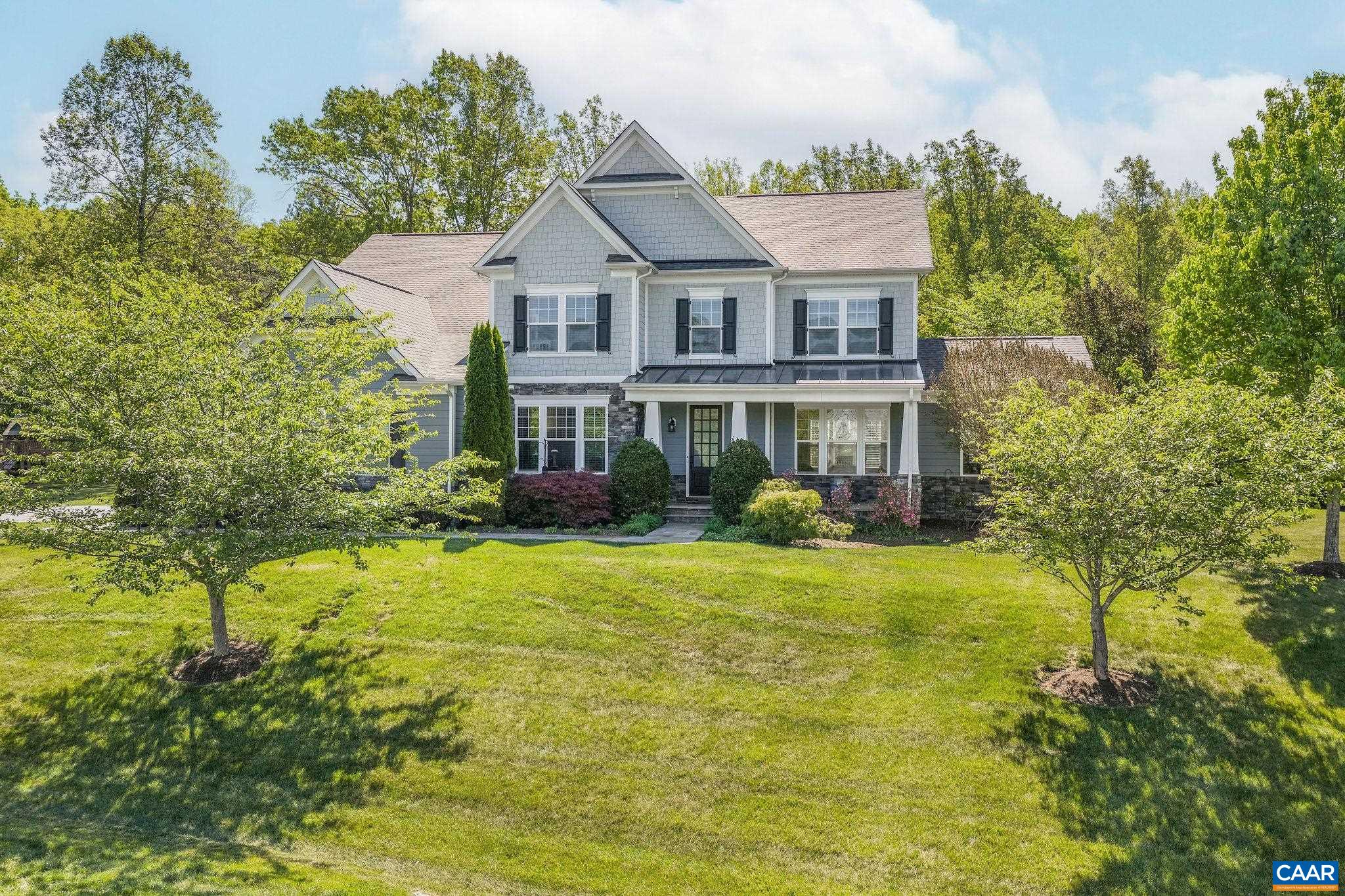 1630 Victor Place Charlottesville, VA 22903 - Photo 4 of 73 a front view of a house with a yard and trees