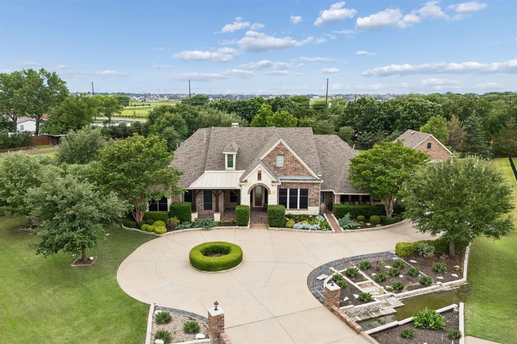 5802 Corinth Chapel Road Parker, TX 75002 - Photo 39 of 40 Beautiful drive up appeal with circular drive, manicured grounds and gorgeous stone entry. The home is graced with two porches along the front of the home. Electric sunshades provide light control and privacy.