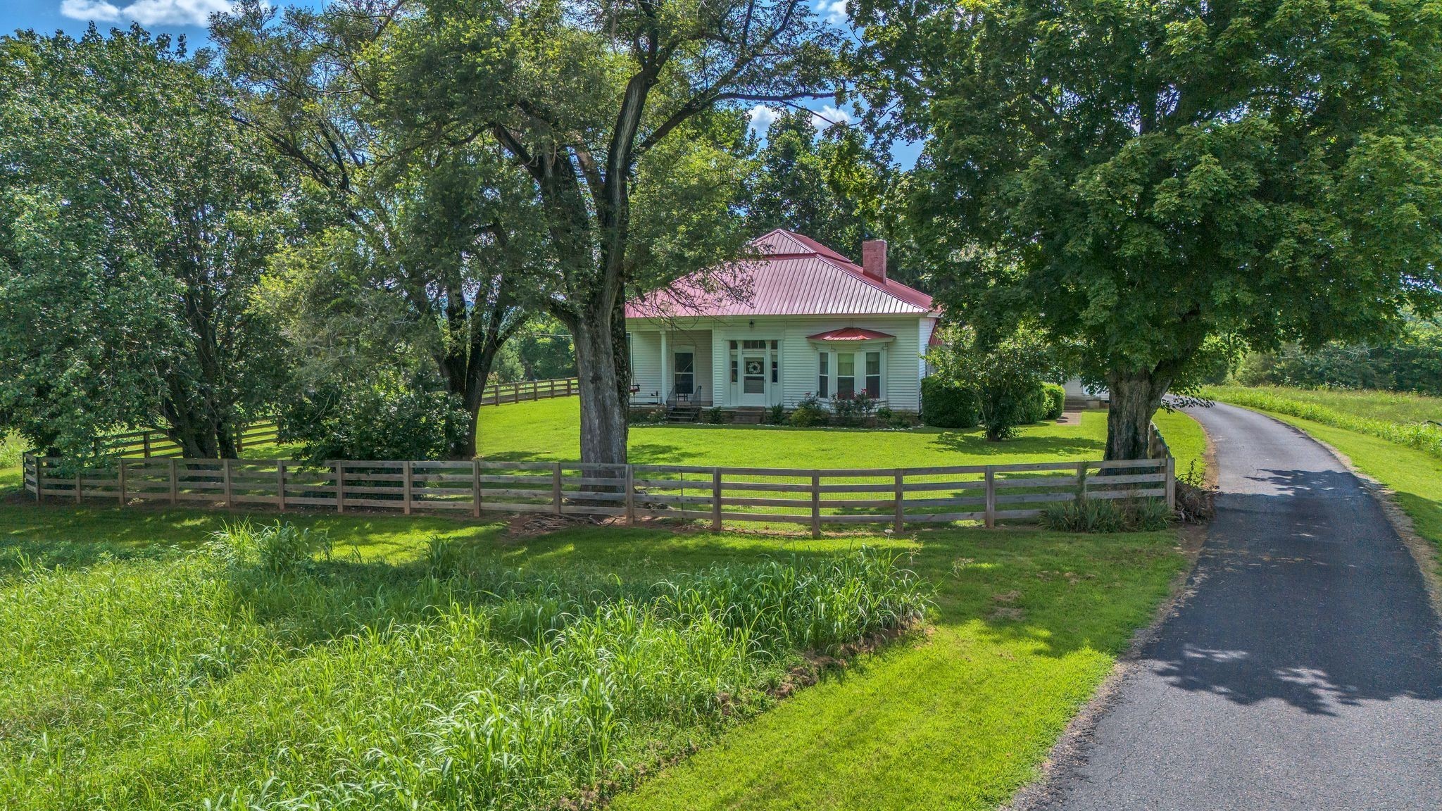 4125 Trinity Road Franklin, TN 37067 - Photo 7 of 44 a view of a house with a big yard potted plants and large tree
