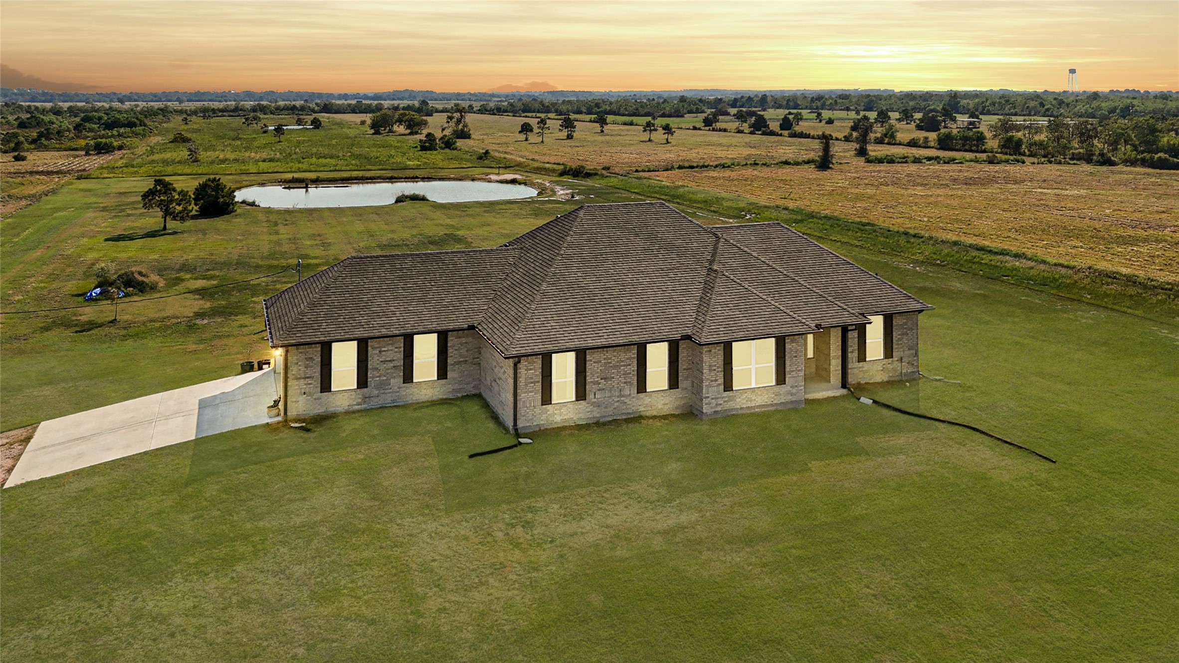 2256 West Bayshore Road Anahuac, TX 77514 - Photo 1 of 34 an aerial view of residential houses with outdoor space and ocean