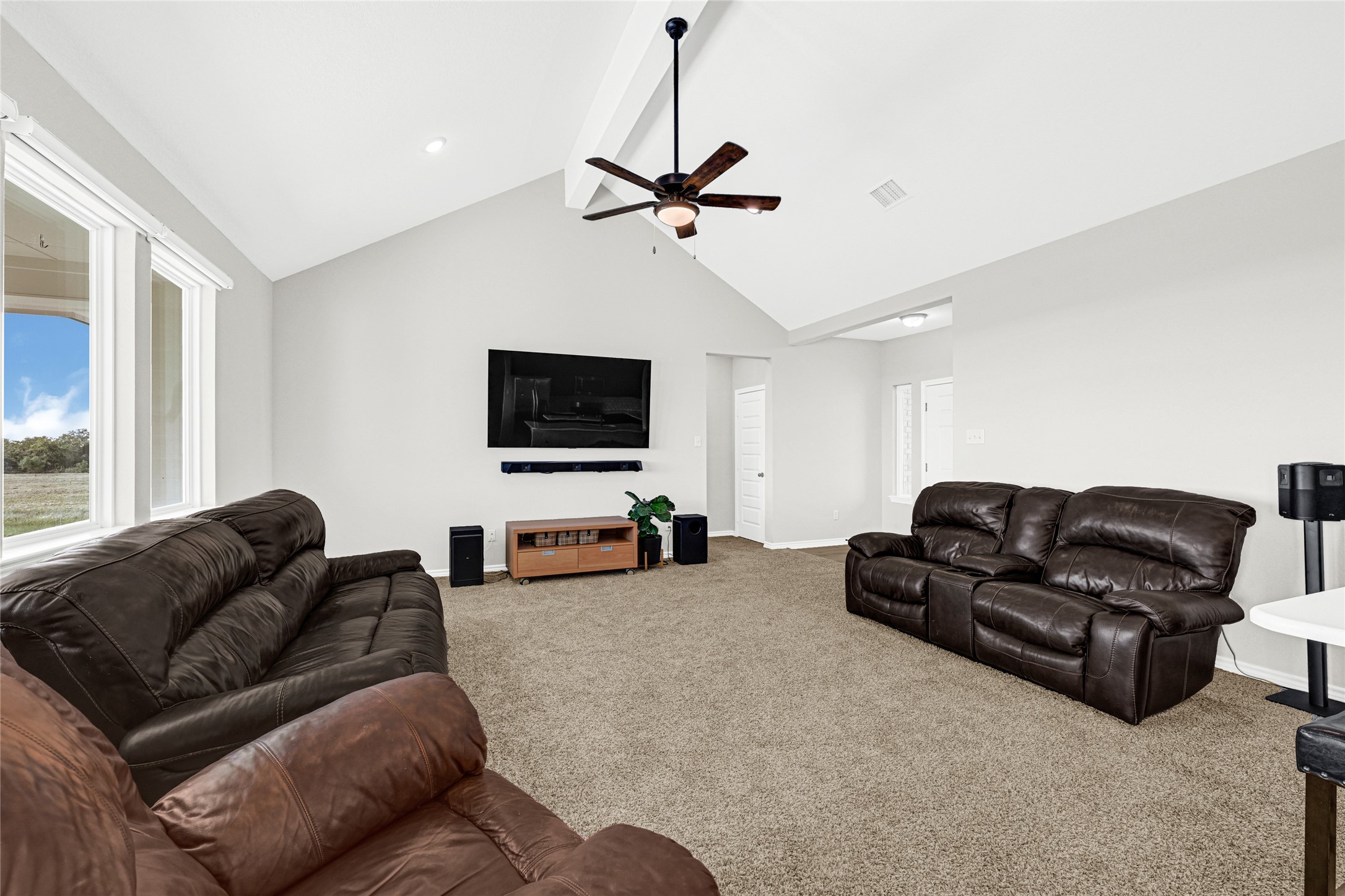 2256 West Bayshore Road Anahuac, TX 77514 - Photo 15 of 34 a living room with furniture and a flat screen tv