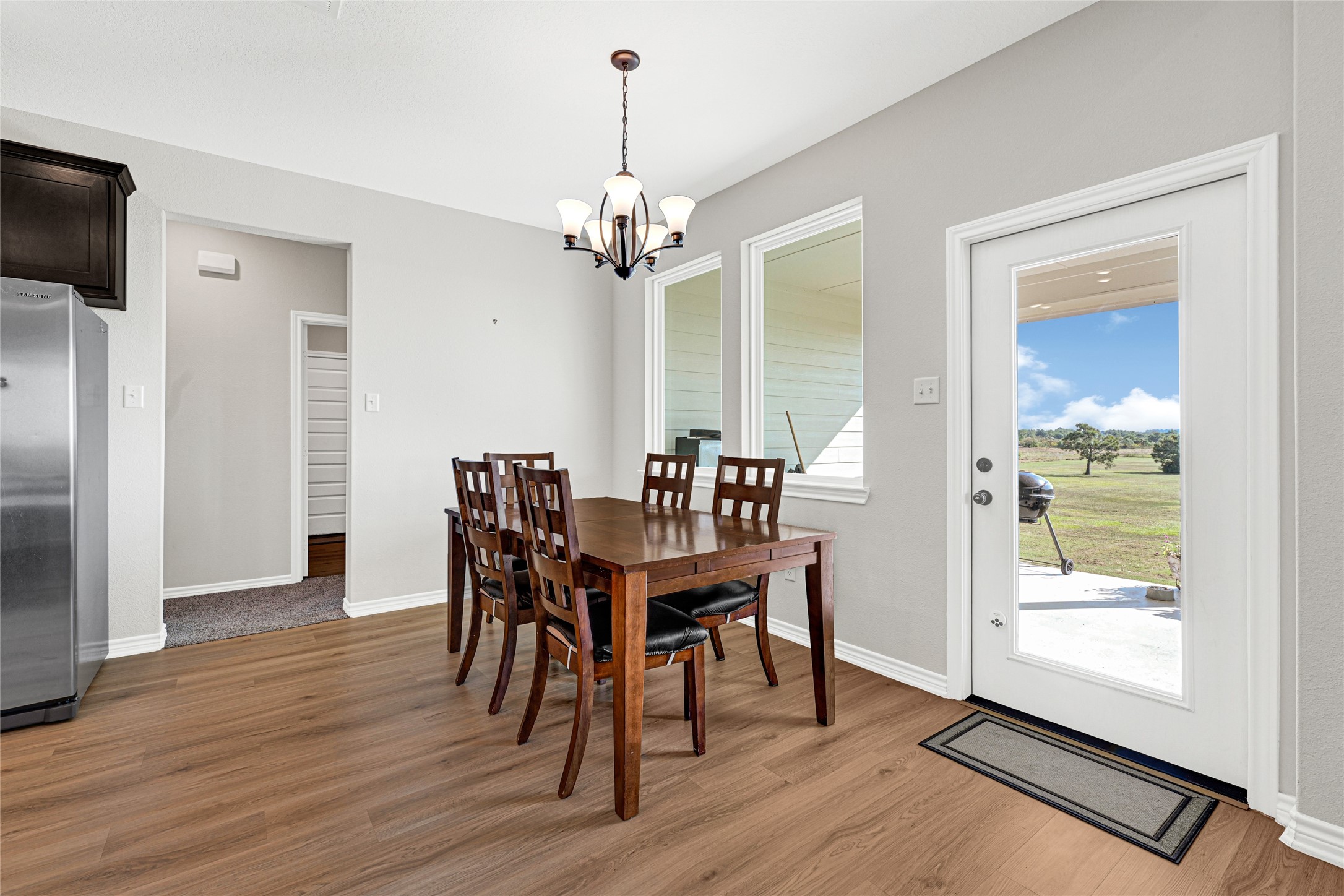 2256 West Bayshore Road Anahuac, TX 77514 - Photo 17 of 34 a view of a dining room with furniture window and wooden floor