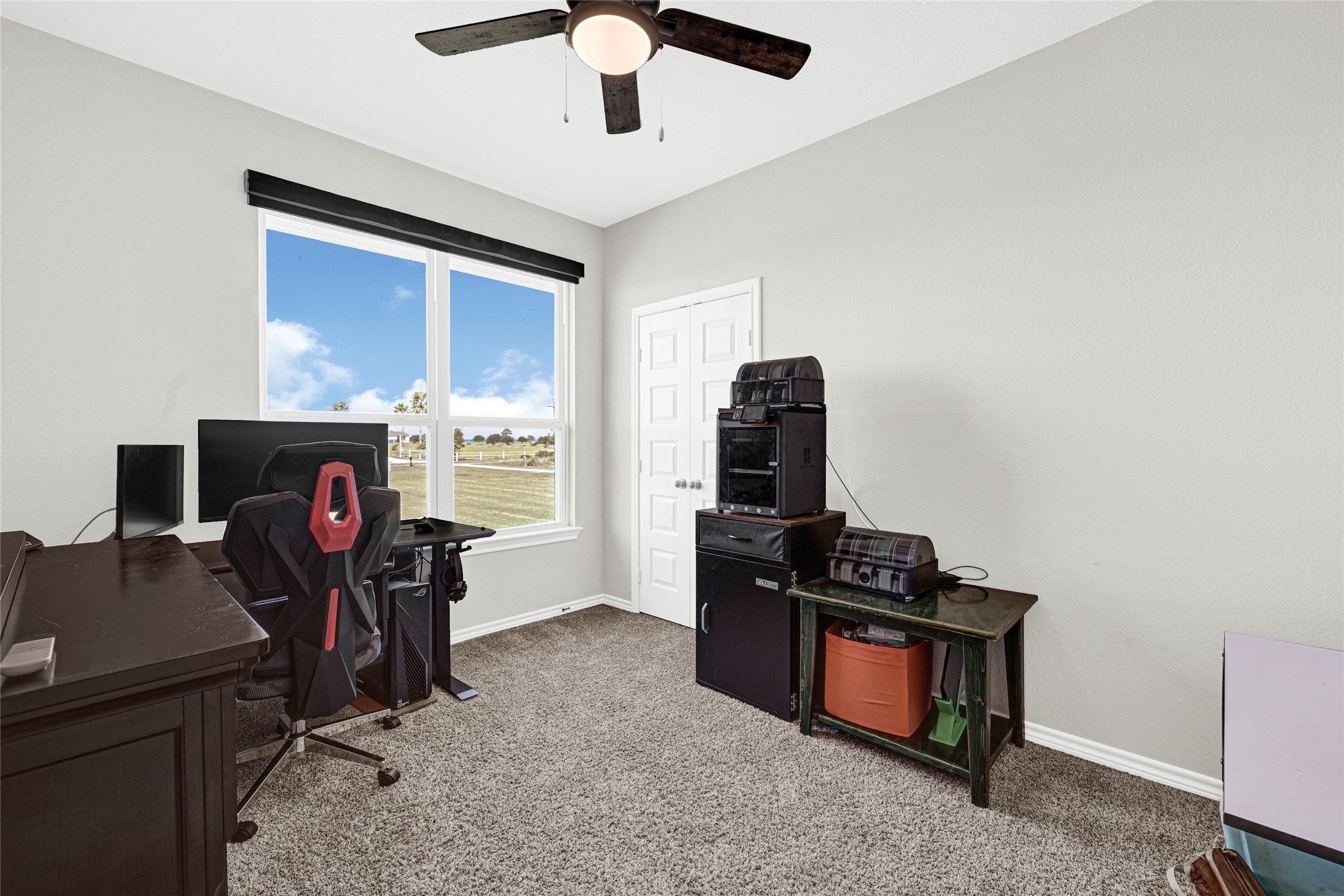 2256 West Bayshore Road Anahuac, TX 77514 - Photo 20 of 34 a view of a workspace with furniture and a window