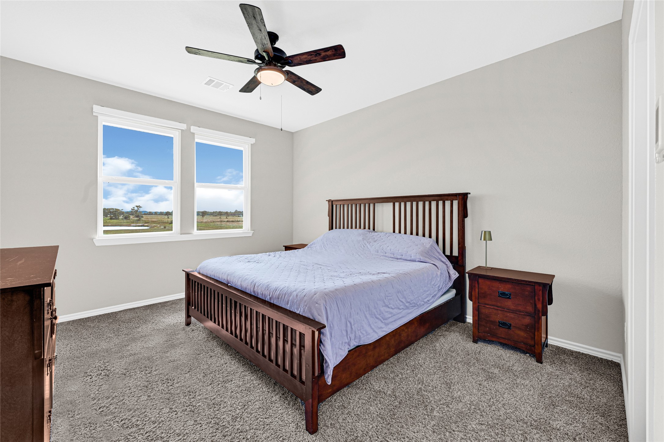 2256 West Bayshore Road Anahuac, TX 77514 - Photo 21 of 34 a bedroom with a bed and a window