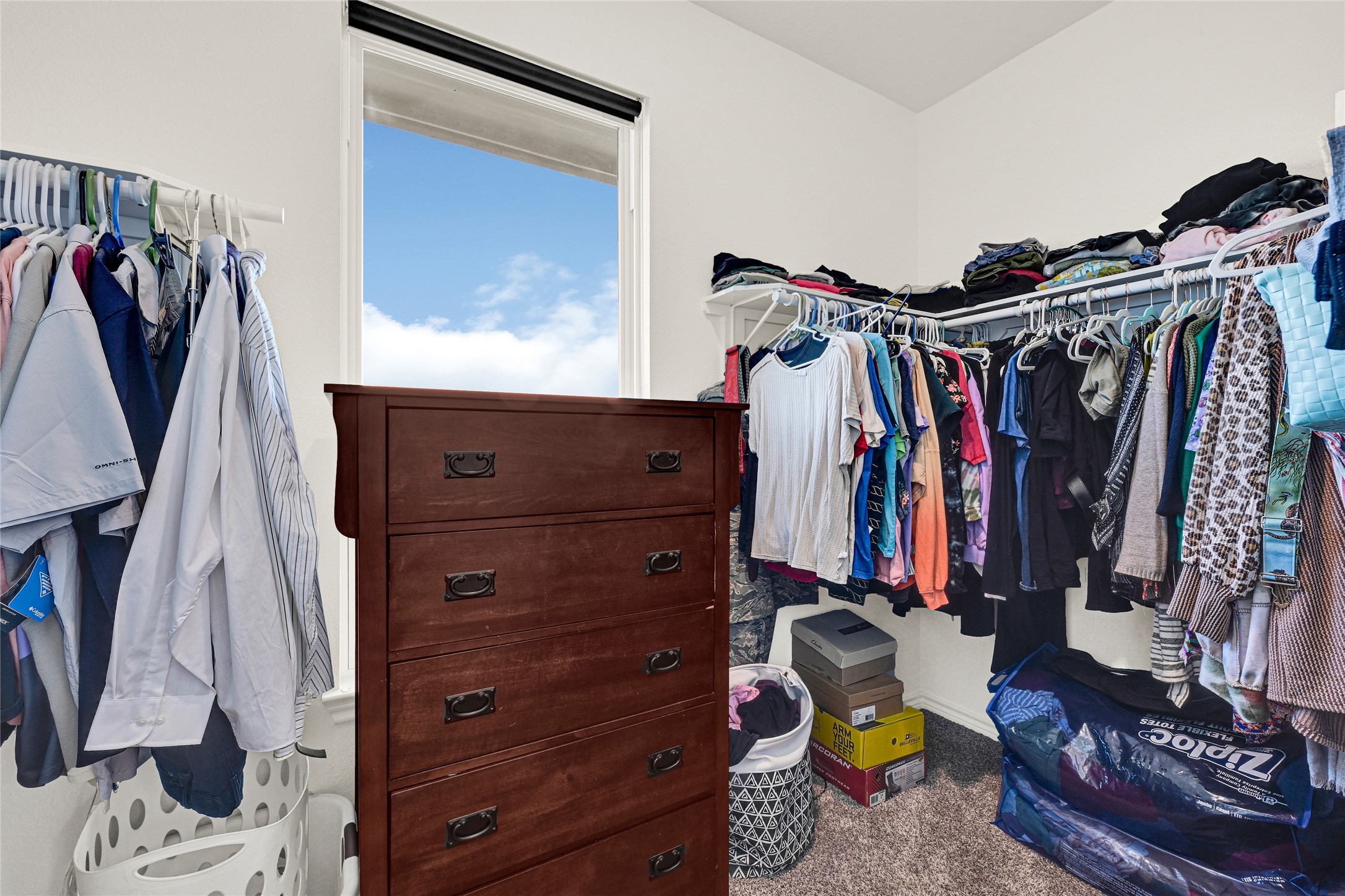 2256 West Bayshore Road Anahuac, TX 77514 - Photo 25 of 34 a view of walk in closet with clothes