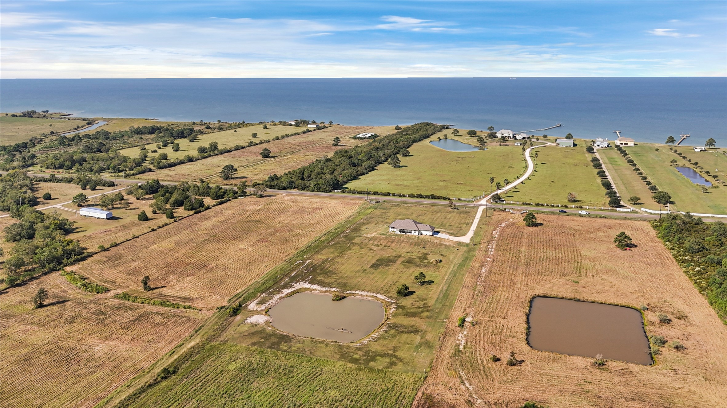 2256 West Bayshore Road Anahuac, TX 77514 - Photo 3 of 34 an aerial view of residential houses with outdoor space