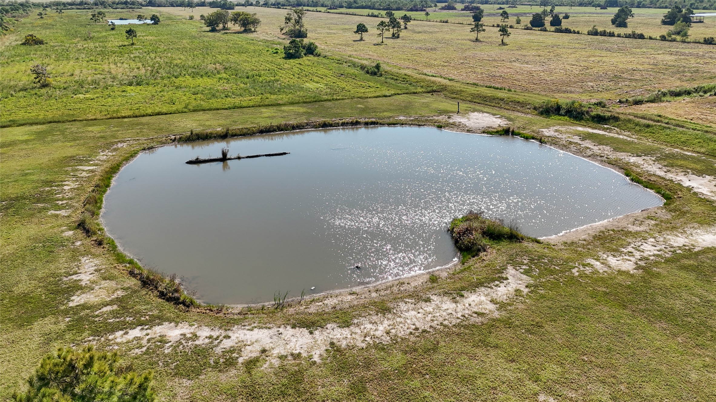 2256 West Bayshore Road Anahuac, TX 77514 - Photo 7 of 34 a view of a wooden floor