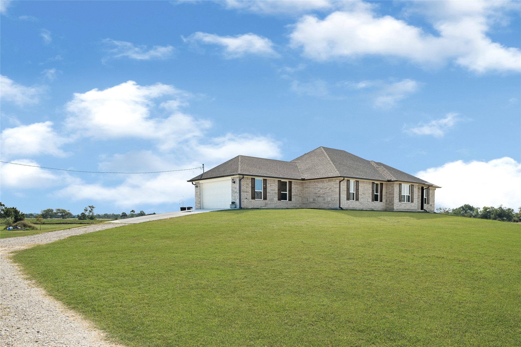 2256 West Bayshore Road Anahuac, TX 77514 - Photo 10 of 34 a view of a house with a yard